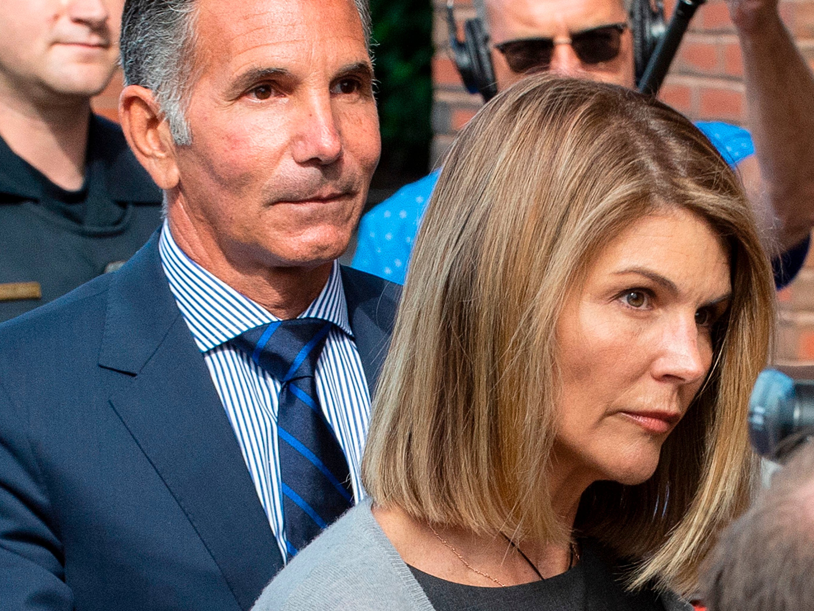 <p>Lori Loughlin and husband Mossimo Giannulli exit the Boston federal courthouse on 27 August 2019</p>