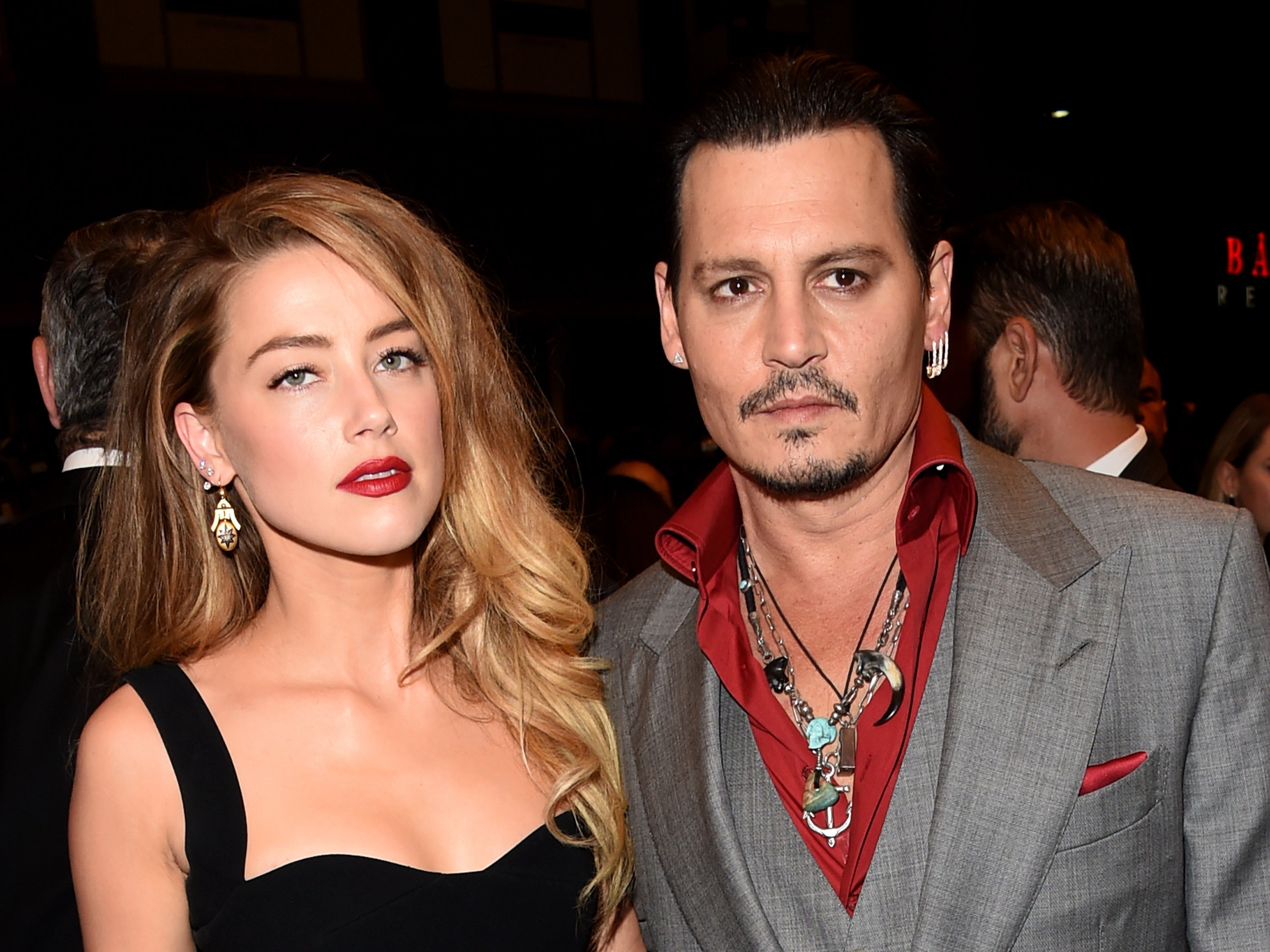 Amber Heard and Johnny Depp attend a premiere during in 2015