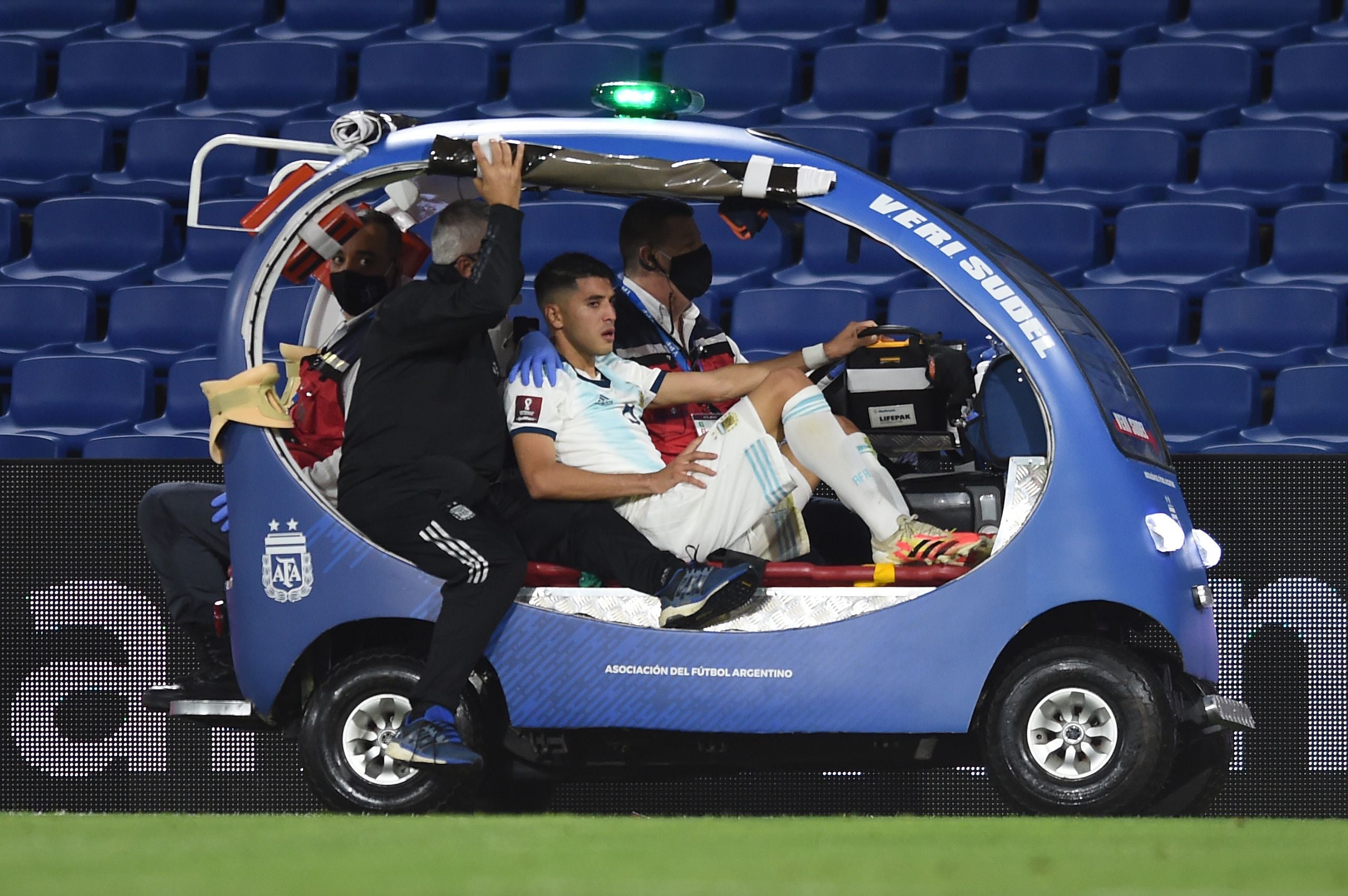 Argentina’s Exequiel Palacios is taken out of the field in a cart after getting injured during the closed-door 2022 FIFA World Cup South American qualifier football match against Paraguay at La Bombonera Stadium in Buenos Aires on November 12, 2020.