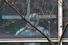 Equipo OMS visita centro de enfermedades animales en Wuhan