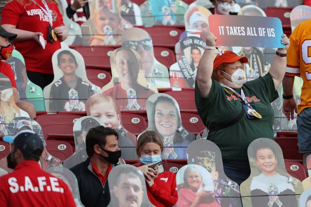 Fans sit in the stands among cardboard cutouts before Super Bowl LV between the Tampa Bay Buccaneers and the Kansas City Chiefs at Raymond James Stadium