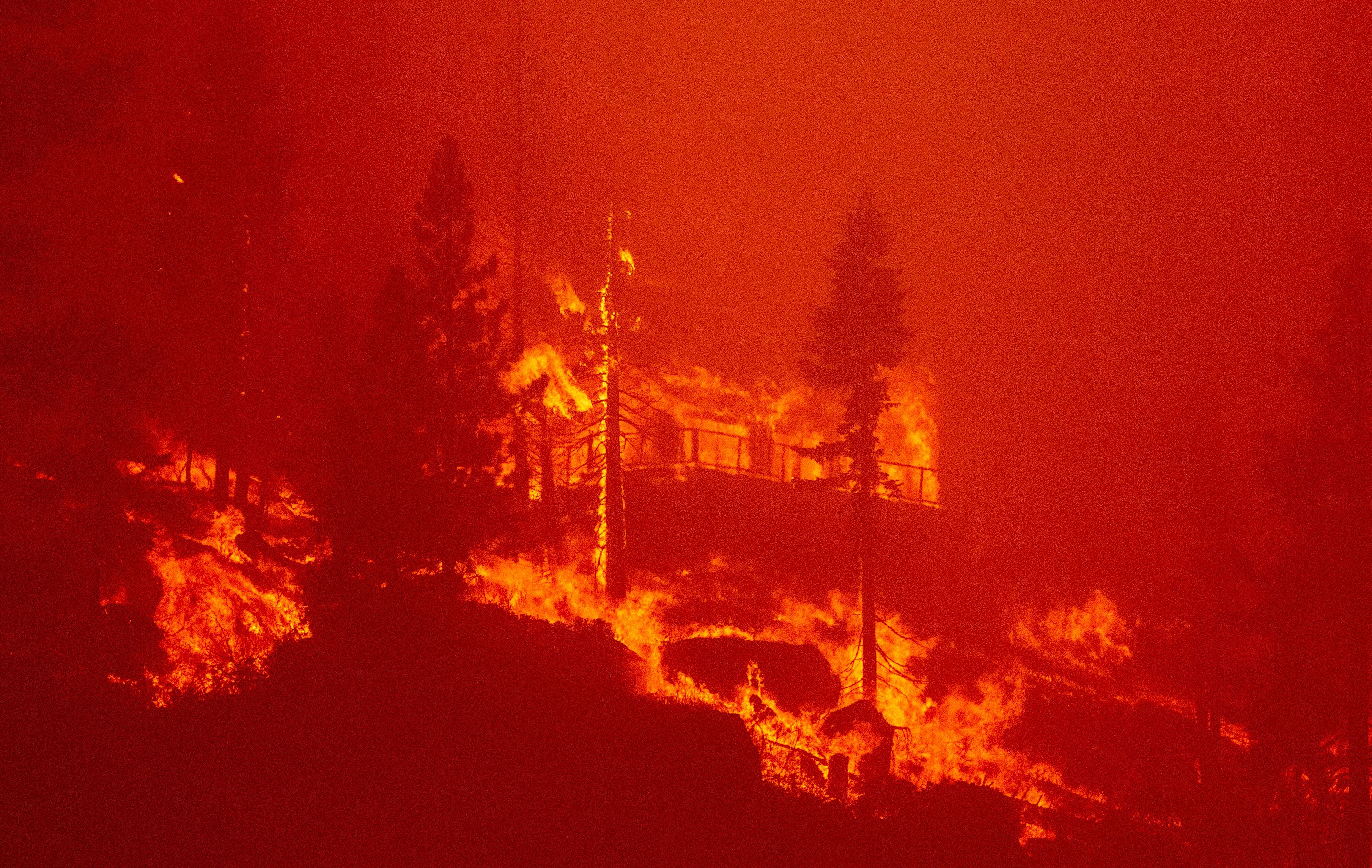 Flames from the Caldor fire consume homes close to South Lake Tahoe, California