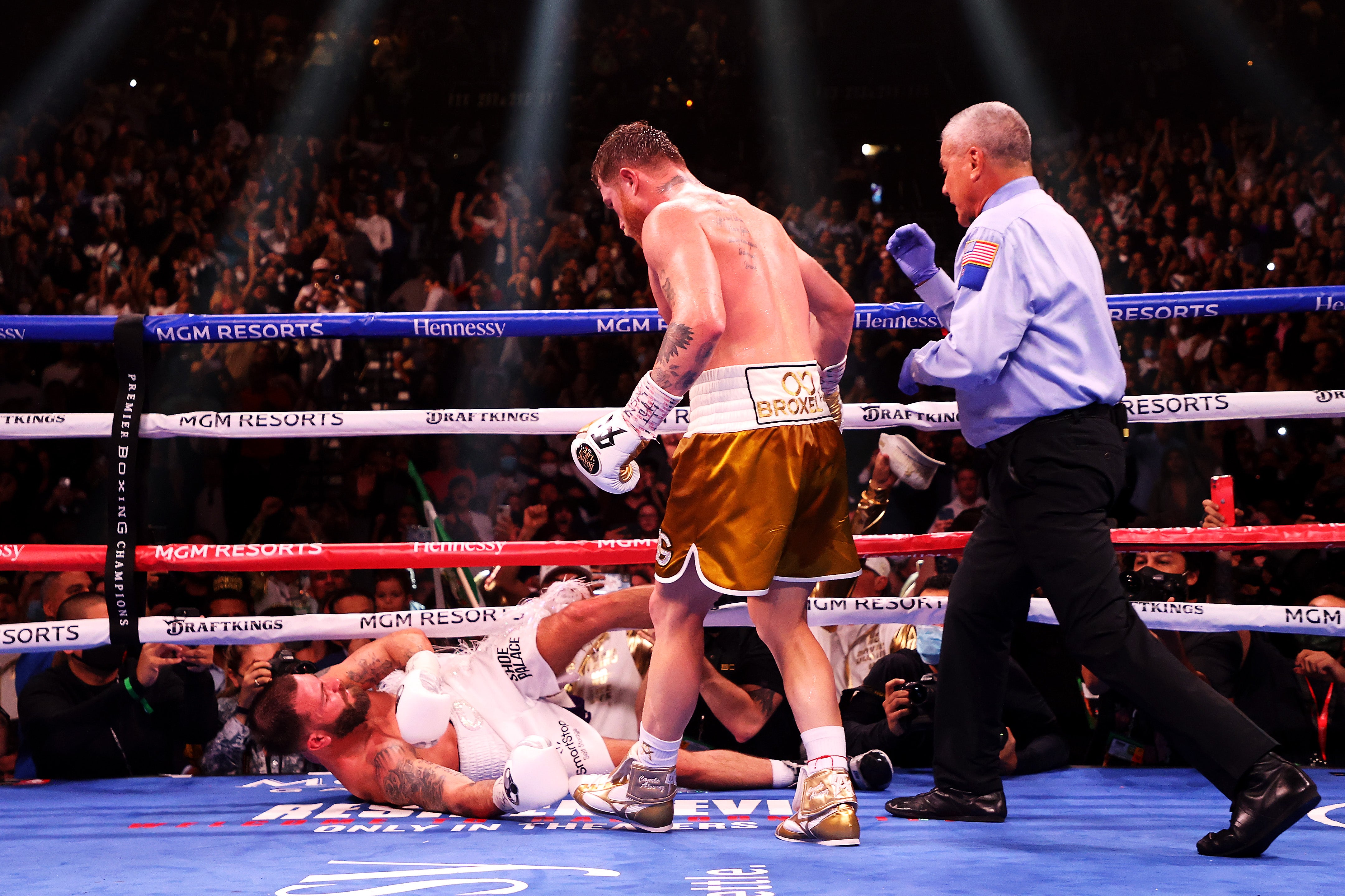 Canelo Alvarez (top) knocks out Caleb Plant in the 11th round