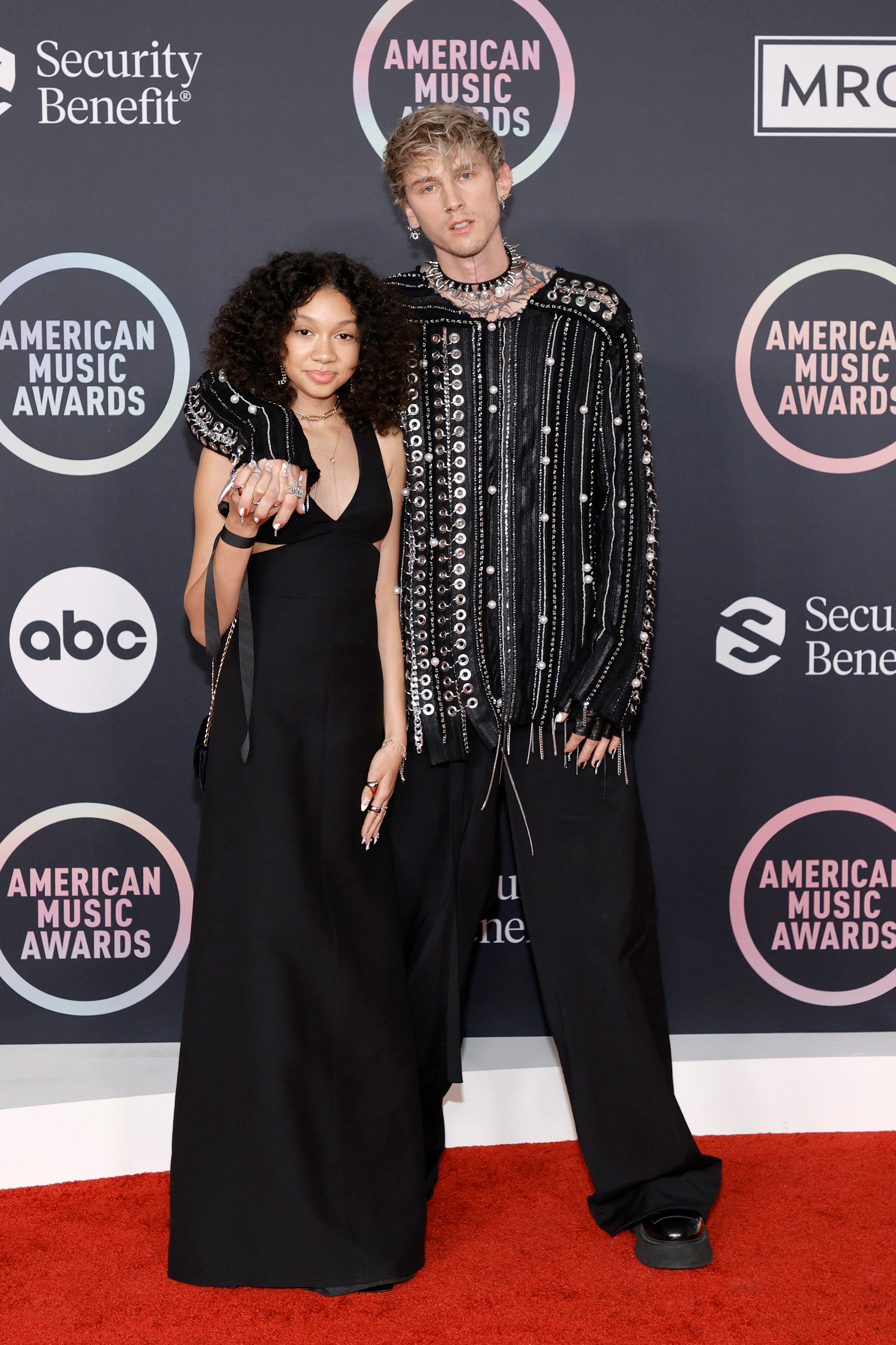 Casie Colson Baker and Machine Gun Kelly attend the 2021 American Music Awards