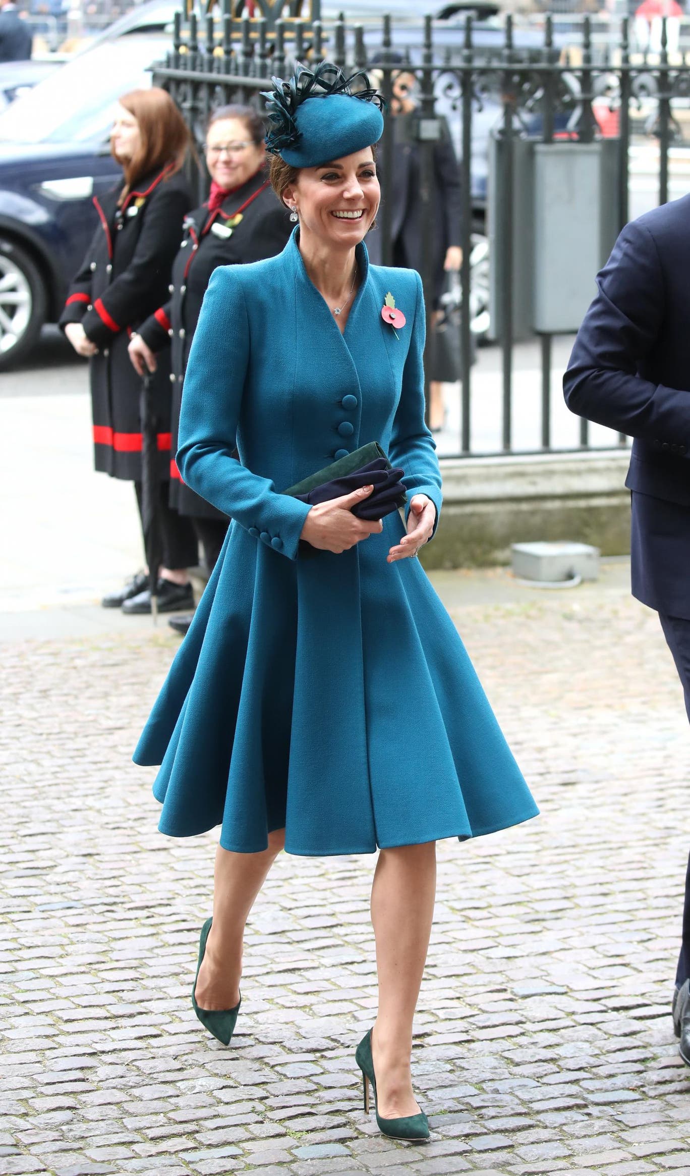 Kate arrived wearing a teal coat