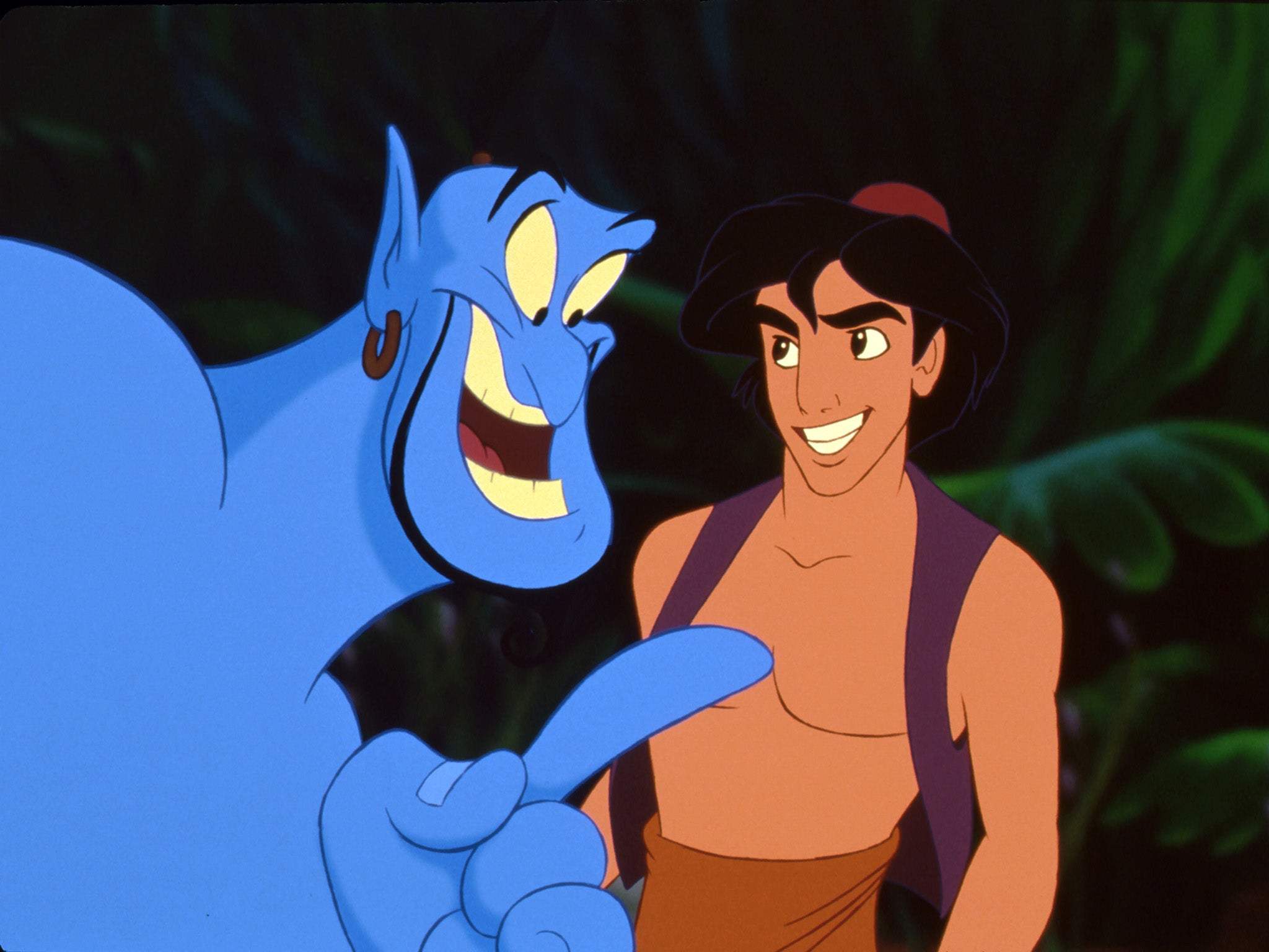 Robin Williams (izquierda) interpreta al Genio en ‘Aladdin’