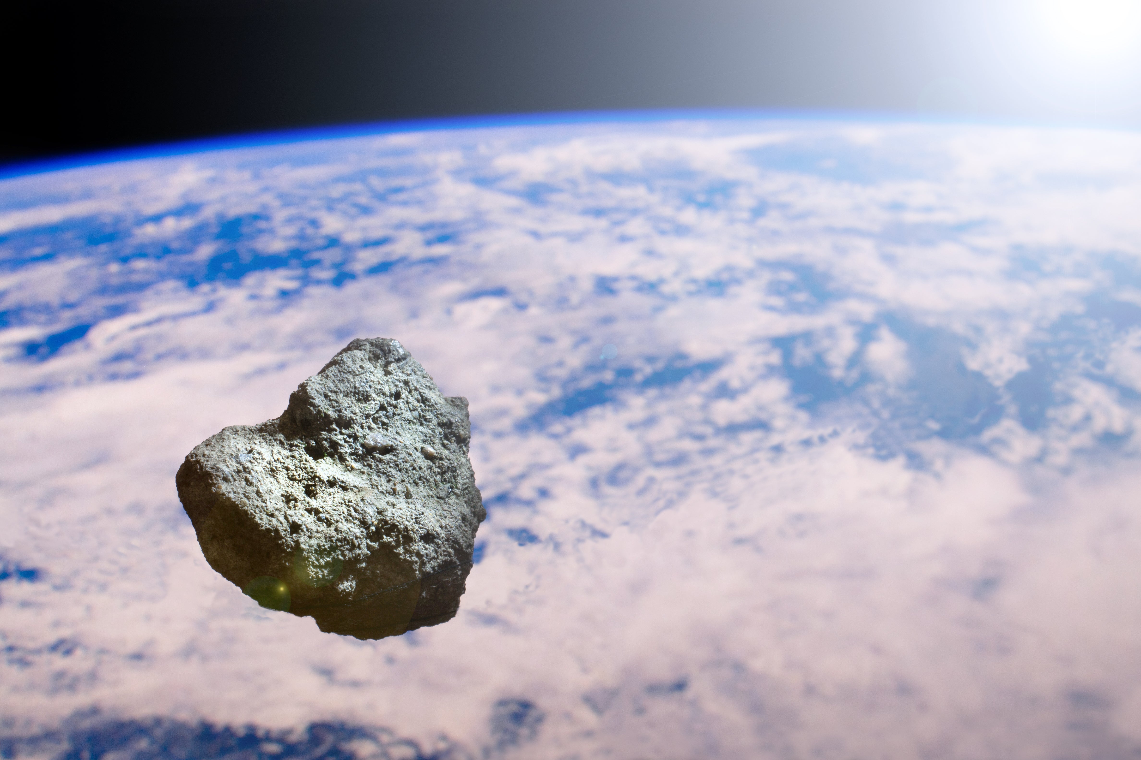 Concepción artística de un asteroide cercano a la Tierra