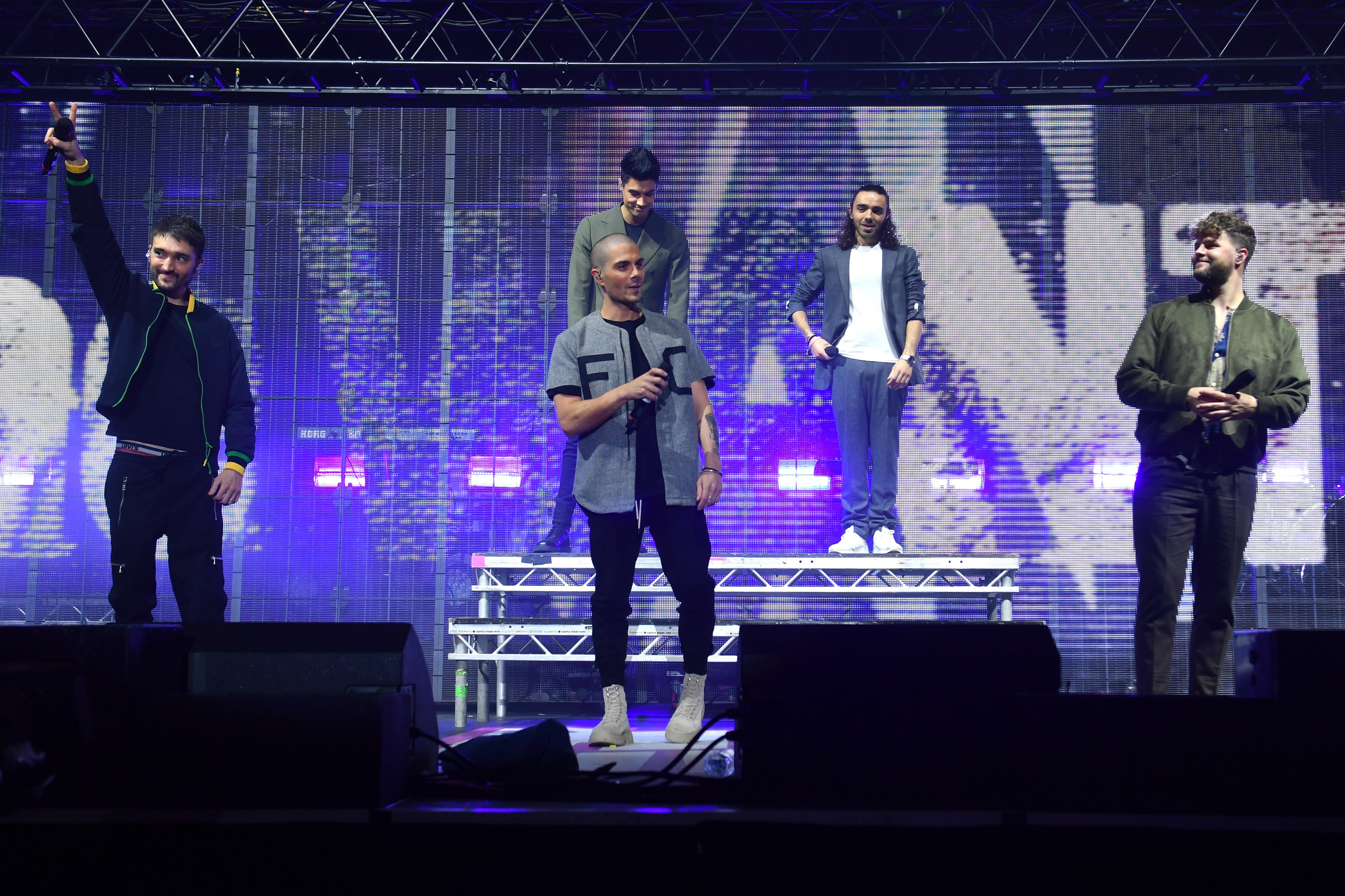 Parker (extremo izquierdo) en el escenario con The Wanted en noviembre