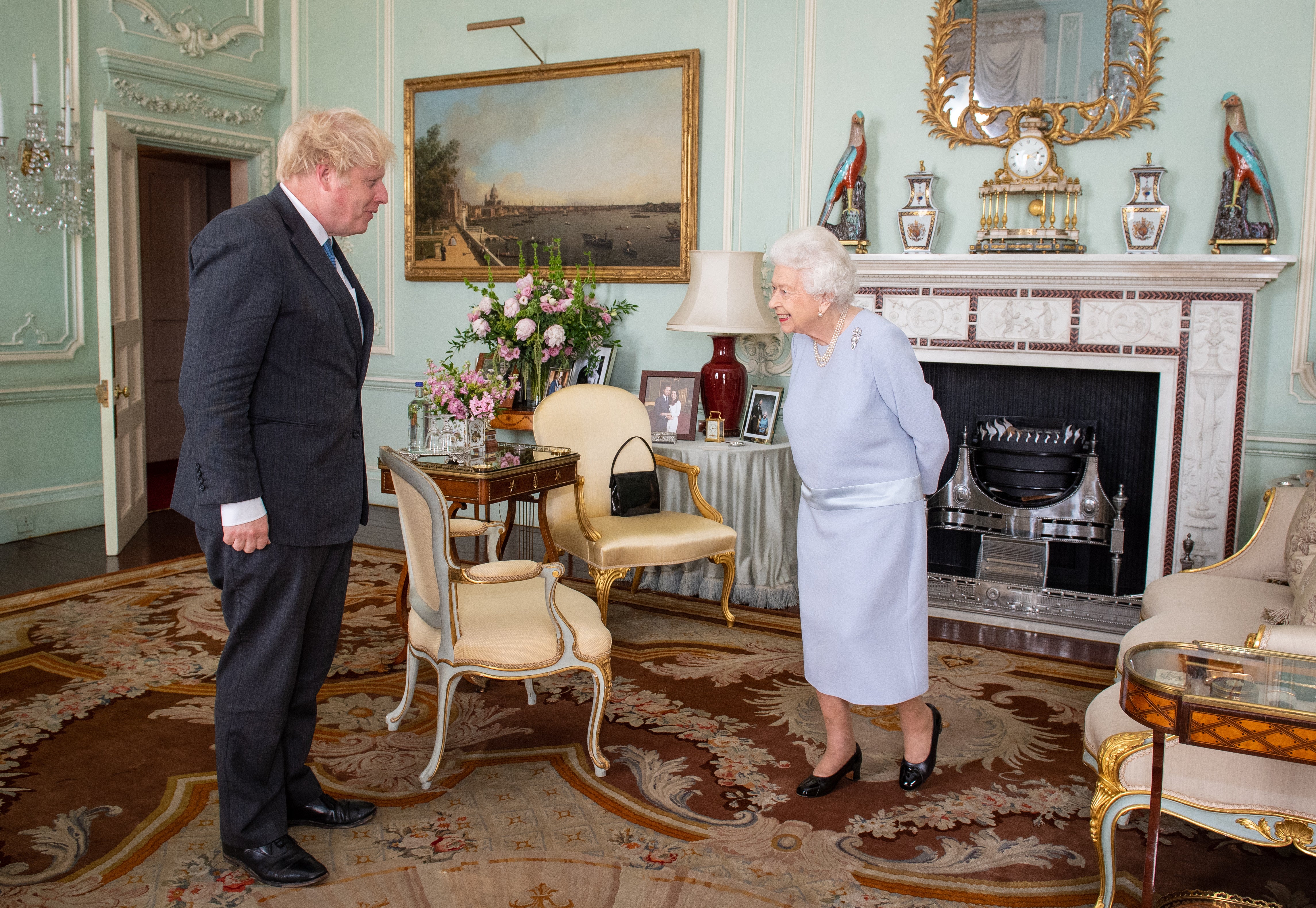 Queen Elizabeth II greeting Boris Johnson at Buckingham Palace for their first in-person weekly audience during the coronavirus pandemic (PA)