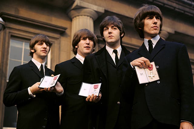 <p>Sir Paul first met the Queen in 1965 when The Beatles were made MBE (PA)</p>