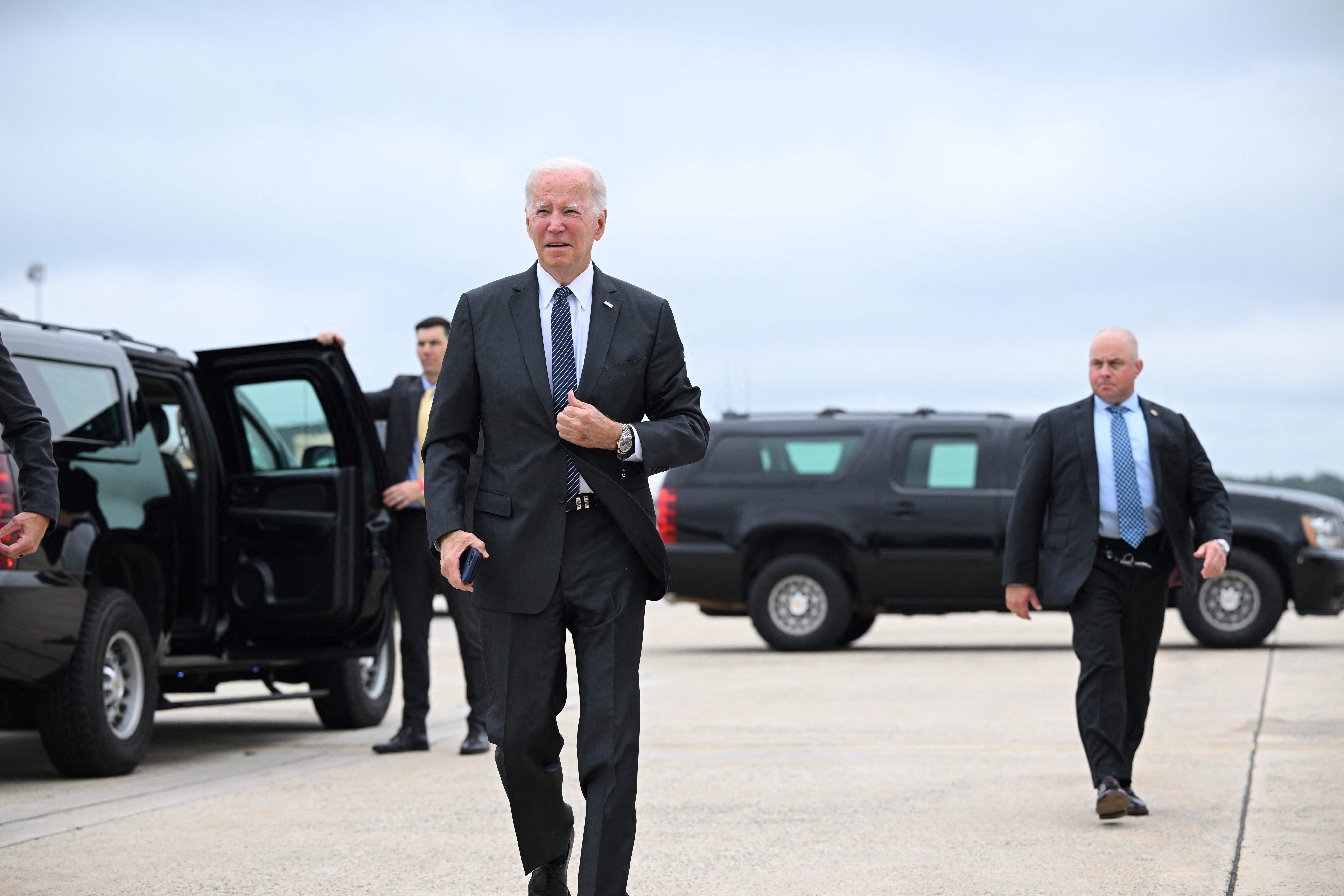 US President Joe Biden makes his way to board Air Force One before departing from Andrews Air Force Base in Maryland on September 12, 2022. - Biden is travelling to Boston to deliver remarks on his Bipartisan Infrastructure Law, as well as the Cancer Moonshot