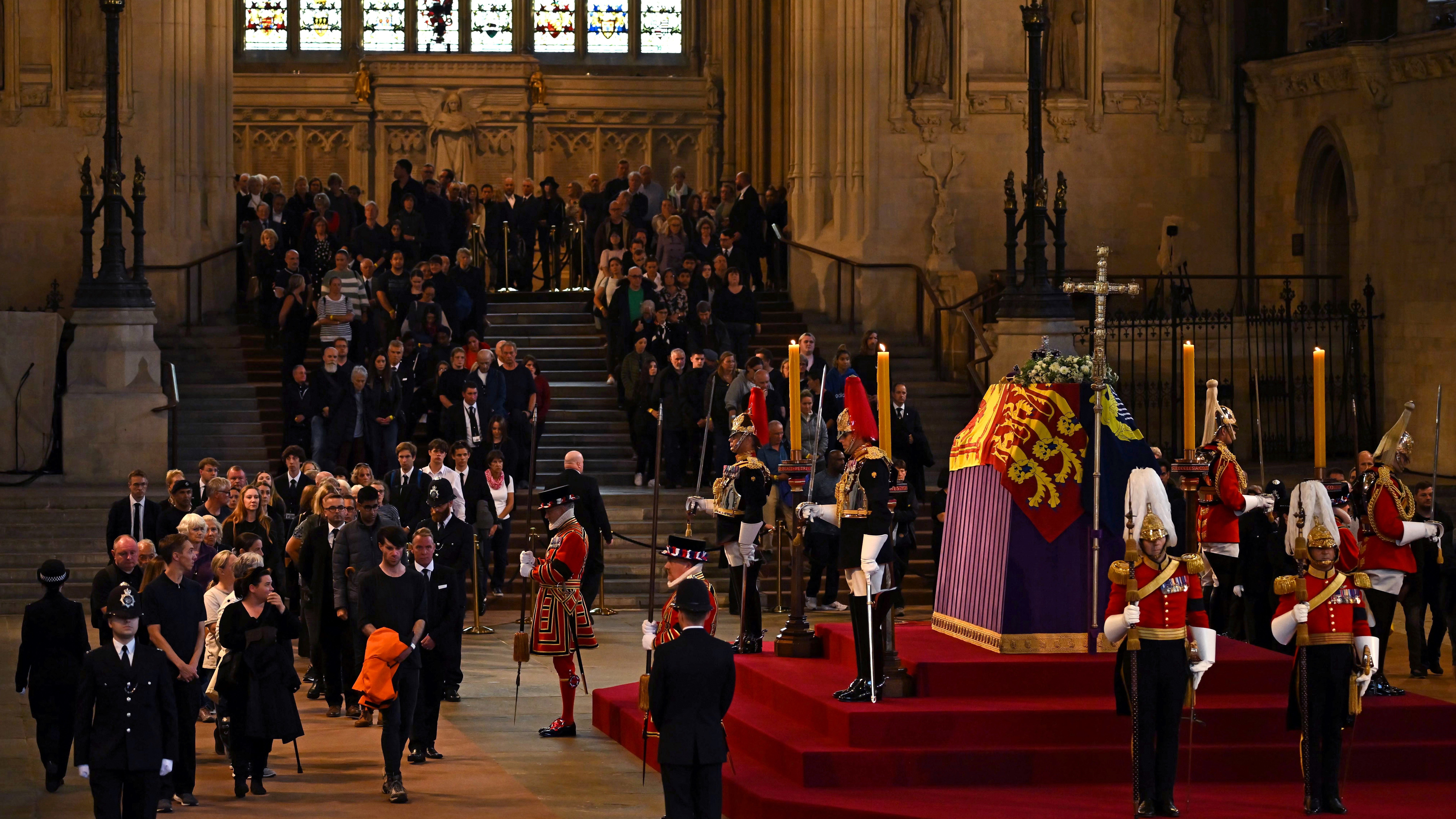 Members of the public pay their respects as the vigil begins around the Queen’s coffin (Ben Stansall/PA)