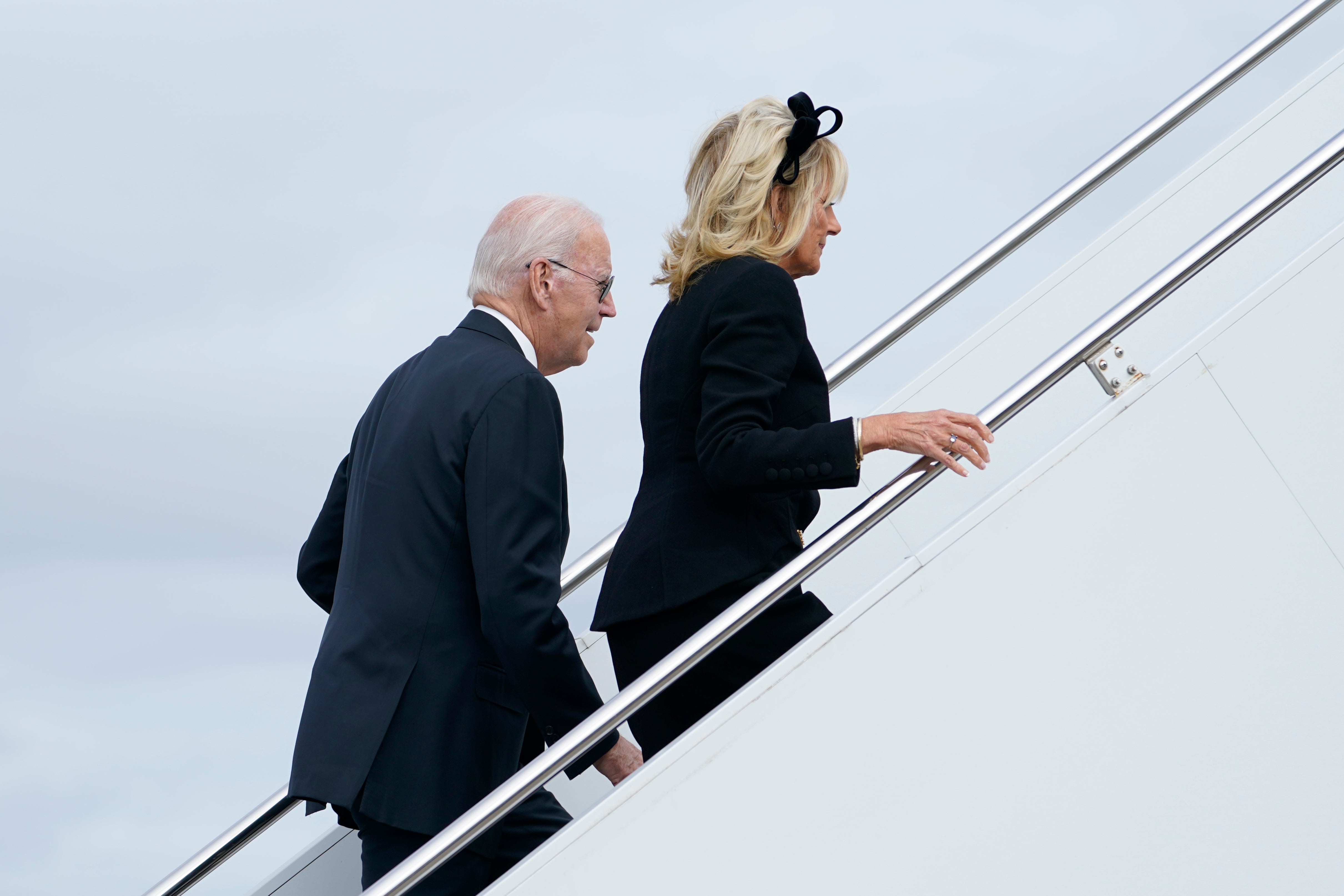 President Joe Biden and first lady Jill Biden walk up the steps of Air Force One at London Stansted Airport, in Stansted, Britain, Monday, Sept. 19, 2022. The Bidens were in London to attend the funeral for Queen Elizabeth II. (AP Photo/Susan Walsh)