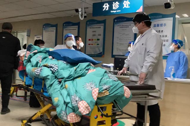 <p>A patient is turned away from a full emergency unit in Zhuozhou, northern China on Wednesday amid the Covid surge</p>