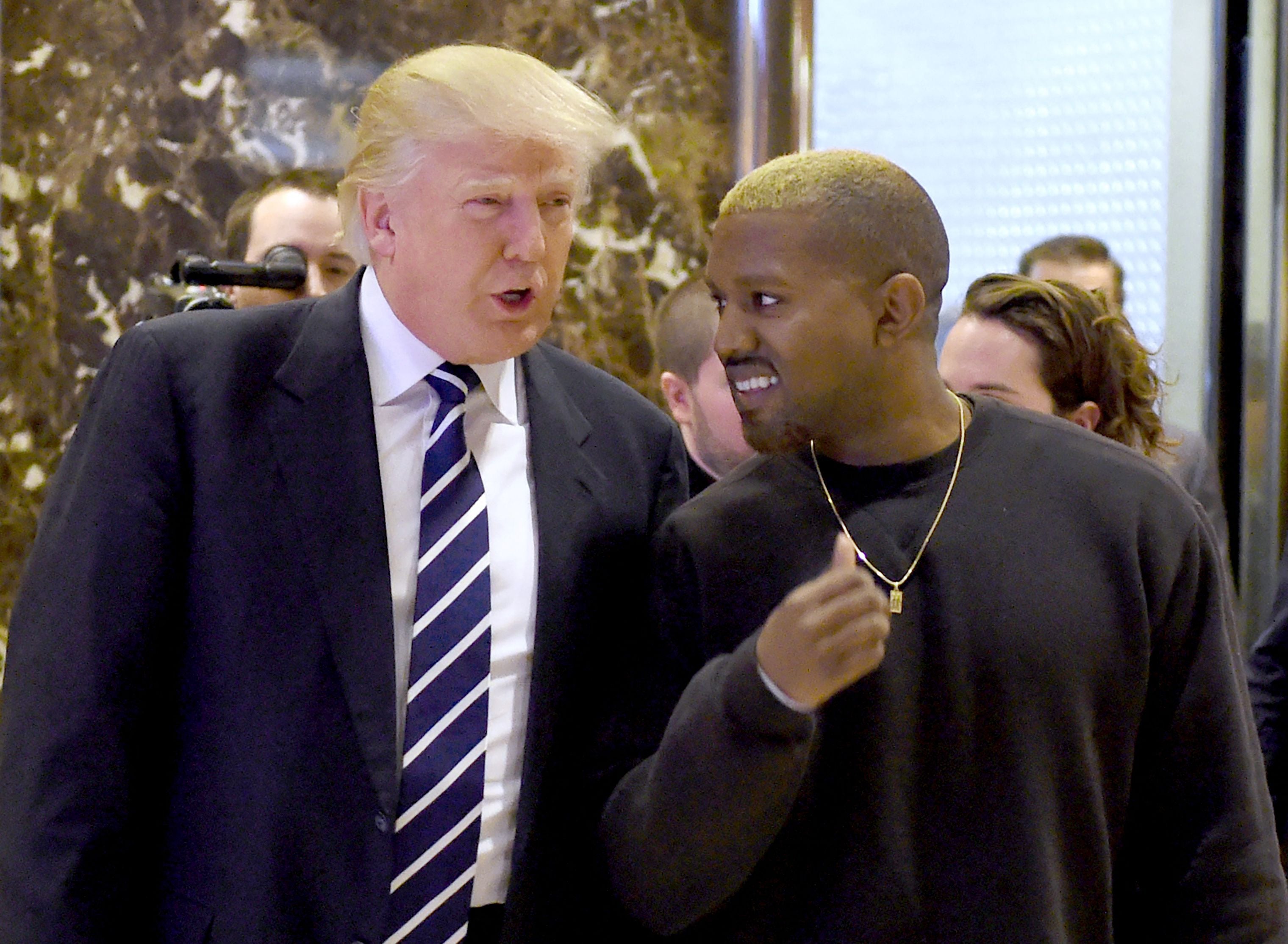 File: Rapper Kanye West and former president Donald Trump