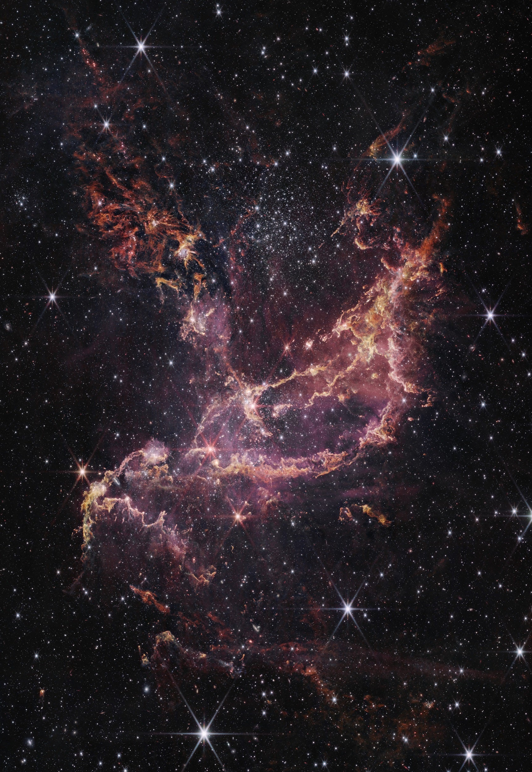 NGC 346, mostrado aquí en esta imagen de la NIRCam (cámara de infrarrojo cercano) del telescopio espacial James Webb de la NASA, es un dinámico cúmulo de estrellas que se encuentra dentro de una nebulosa a 200.000 años luz de distancia