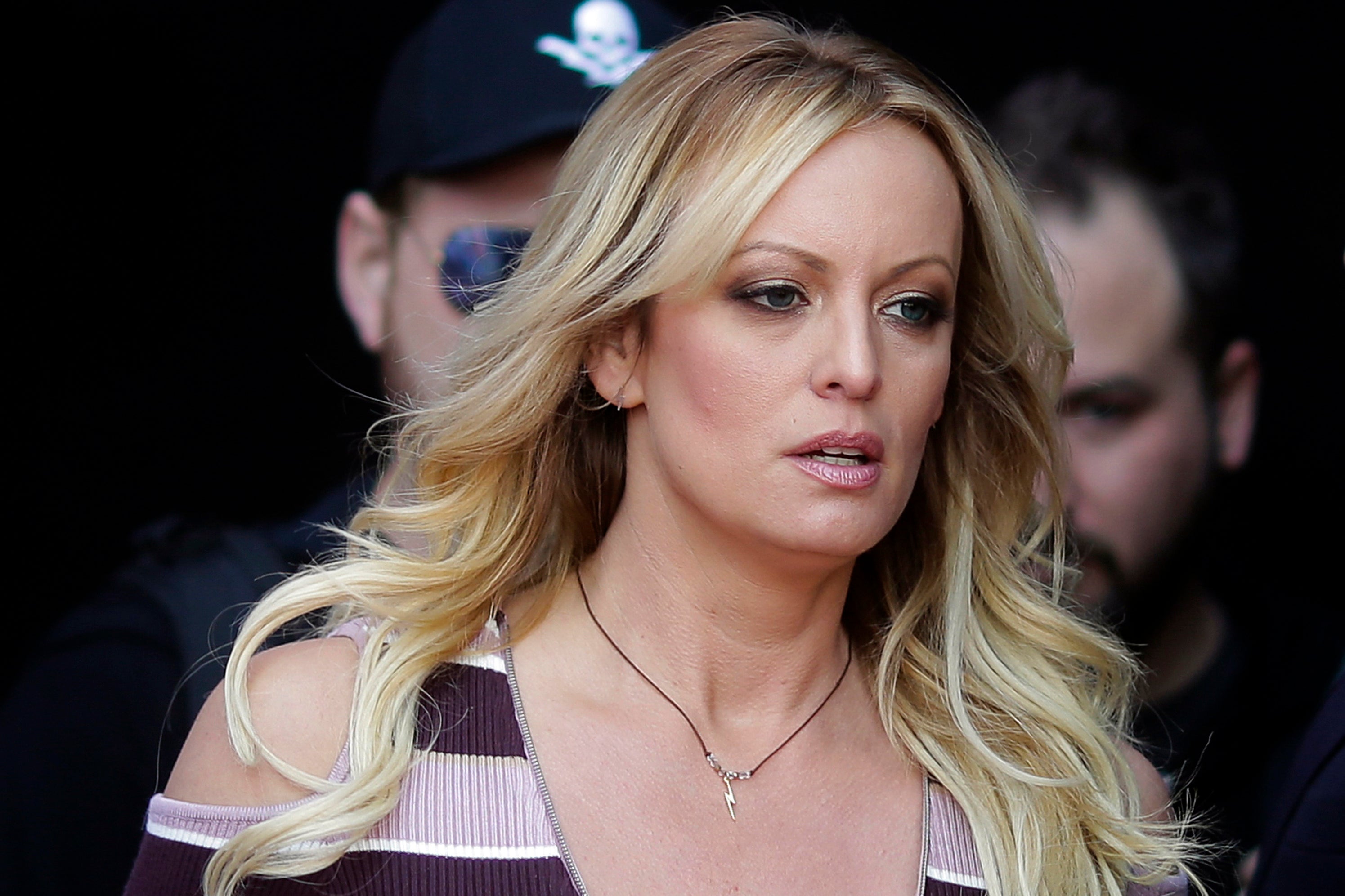 FILE - Adult film actress Stormy Daniels arrives for the opening of the adult entertainment fair Venus in Berlin, on Oct. 11, 2018.