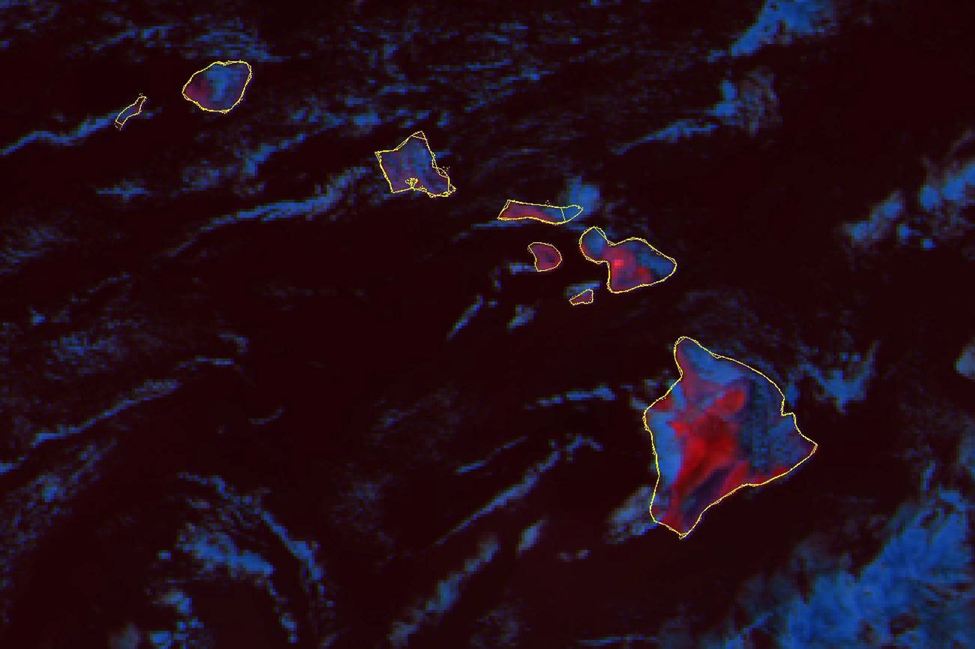 Esta imagen de satélite GOES-18 compuesta de la temperatura del fuego tomada a las 6:30 pm, hora del Este, del miércoles 9 de agosto de 2023 y publicada por la NOAA (Oficina Nacional de Administración Oceánica y Atmosférica), muestra las temperaturas cálidas de la superficie terrestre en rojo en las islas de Hawái. Una peligrosa mezcla de condiciones parecen haberse combinado para hacer que los incendios forestales abran un camino de destrucción en Hawái especialmente dañino, incluyendo fuertes vientos, baja humedad y vegetación seca