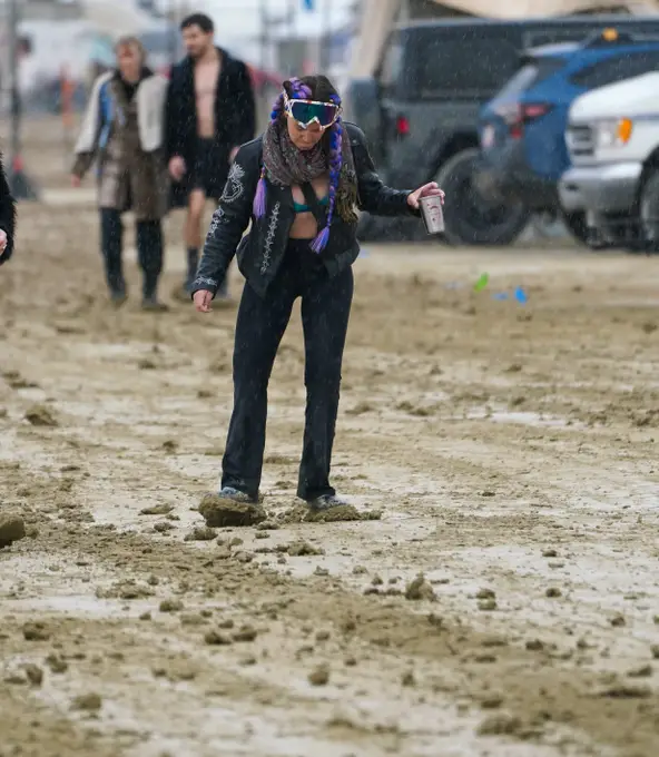 The flooding in Nevada Desert has meant over 70,000 festivalgoers are wading through mud