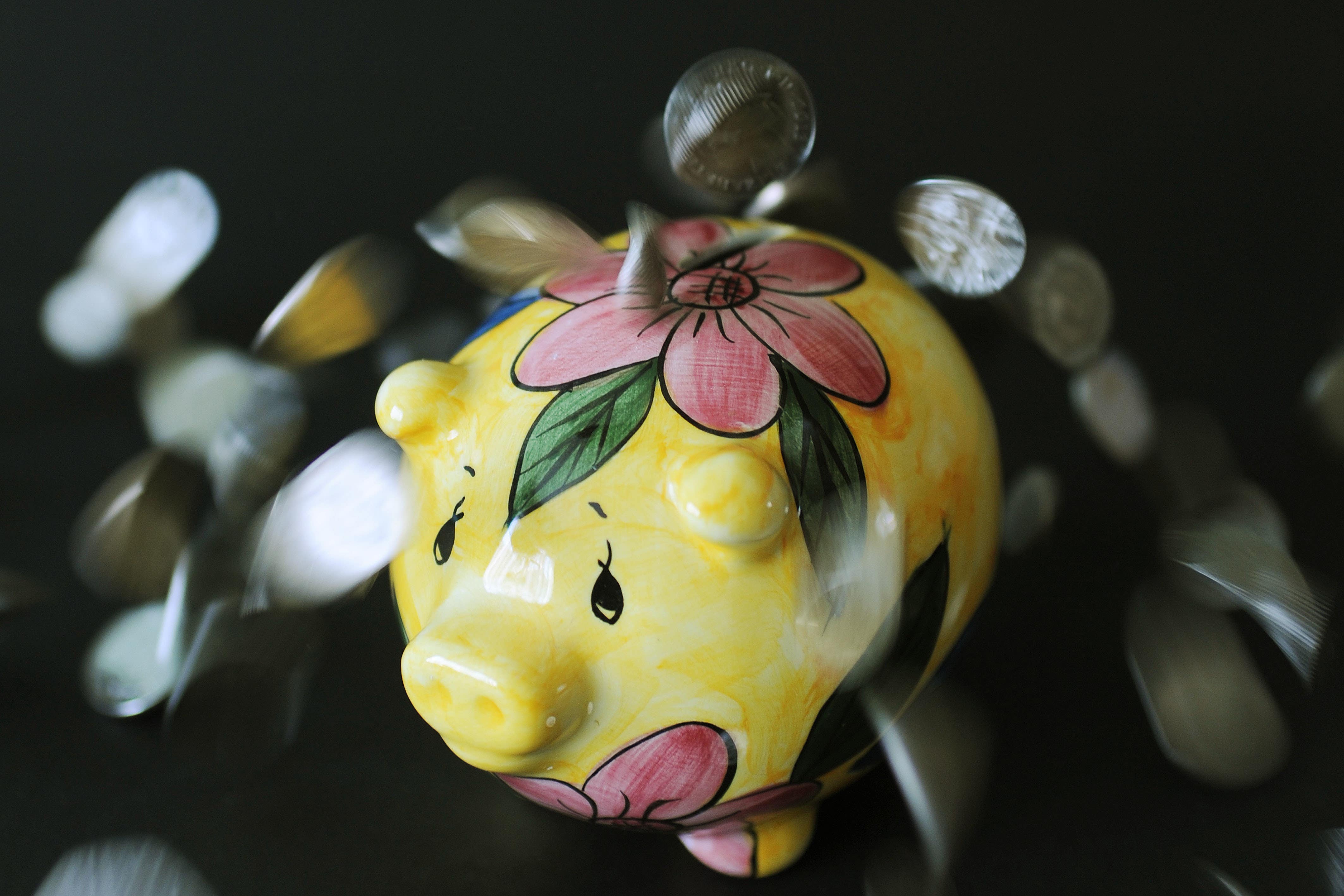 A piggy bank with coins (Nick Ansell/PA)
