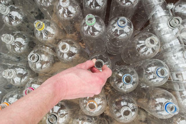 <p>The multinationals have been accused of greenwashing over their plastic bottles recyclability claims (Jonathan Pow/PA)</p>