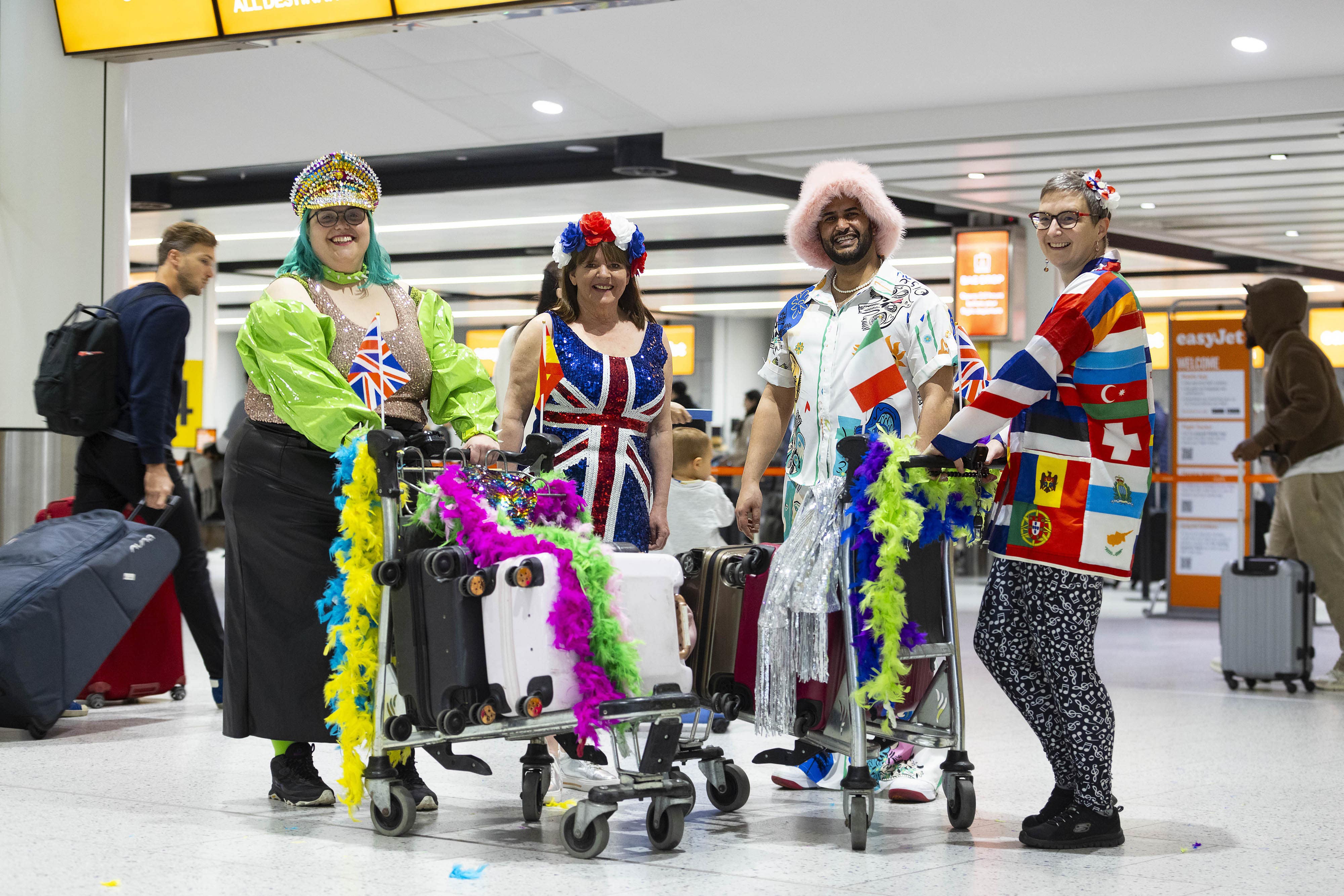 Los fans de Eurovisión se preparan para embarcar en un vuelo especial de fiesta desde Gatwick (David Parry/PA)