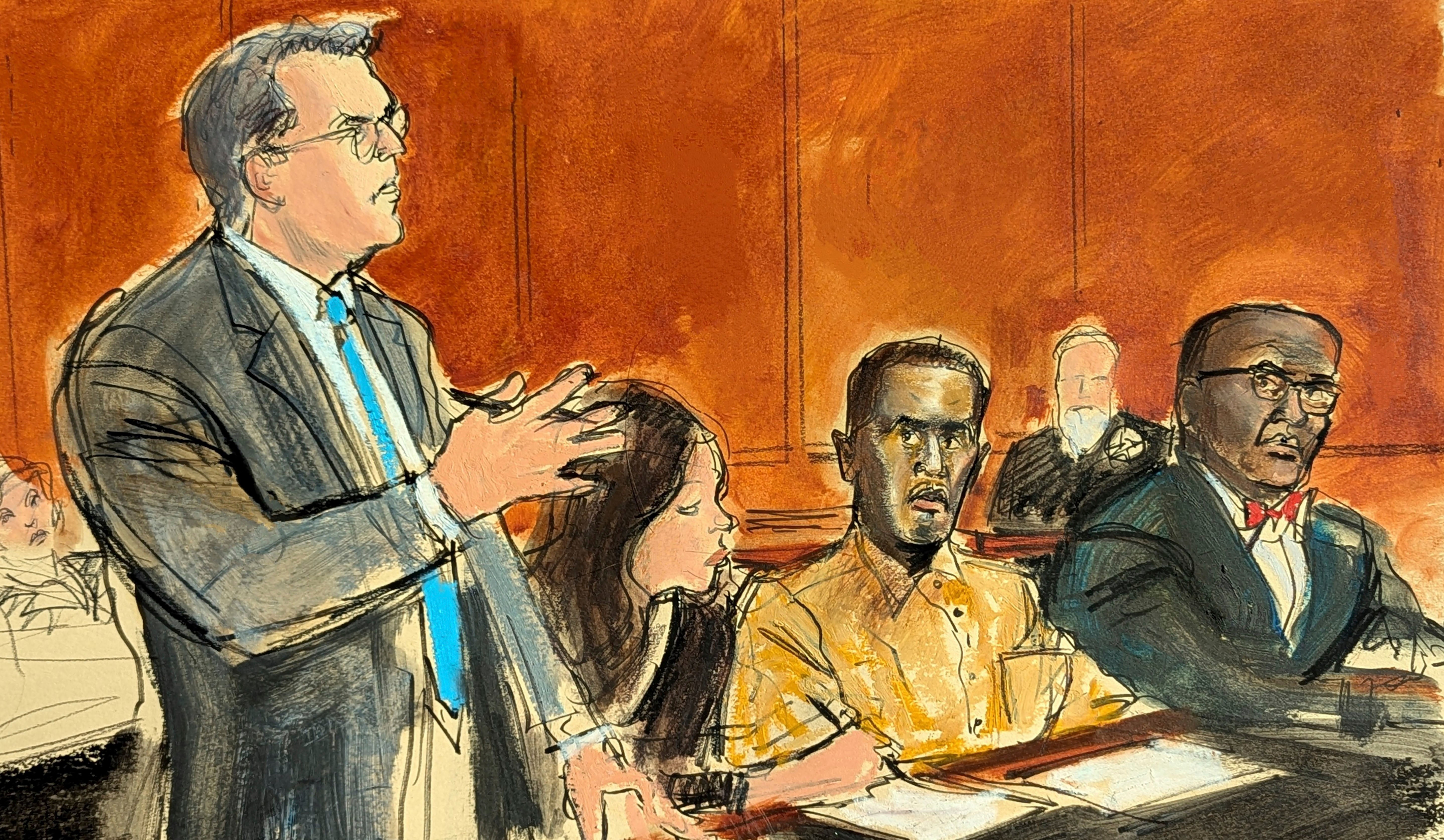 En este boceto de la sala del tribunal, el abogado defensor de Sean “Diddy” Combs, Marc Agnifilo, a la izquierda, se dirige al juez mientras Combs, el segundo sentado desde la derecha, con uniforme de prisión, observa durante una audiencia en un tribunal federal en Nueva York, el jueves 10 de octubre de 2024