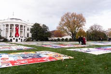 Biden exhibe en la Casa Blanca el manto conmemorativo por el Día Mundial de la Lucha contra el sida