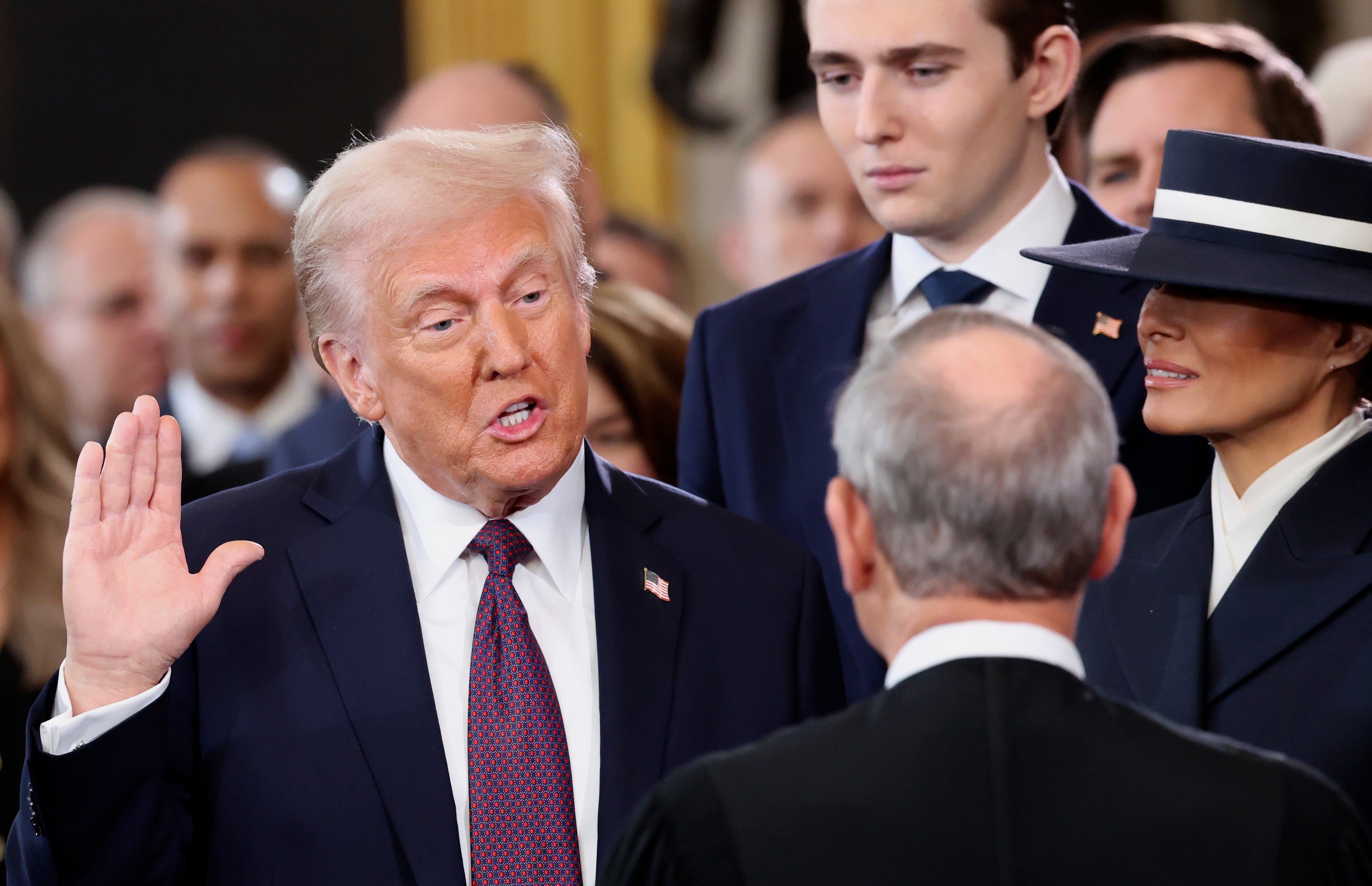 <p>President-elect Donald Trump, from left, takes the oath of office as son Barron Trump and wife Melania Trump watch during the 60th Presidential Inauguration in the Rotunda of the U.S. Capitol in Washington, Monday, Jan. 20, 2025. (Kevin Lamarque/Pool Photo via AP)</p>