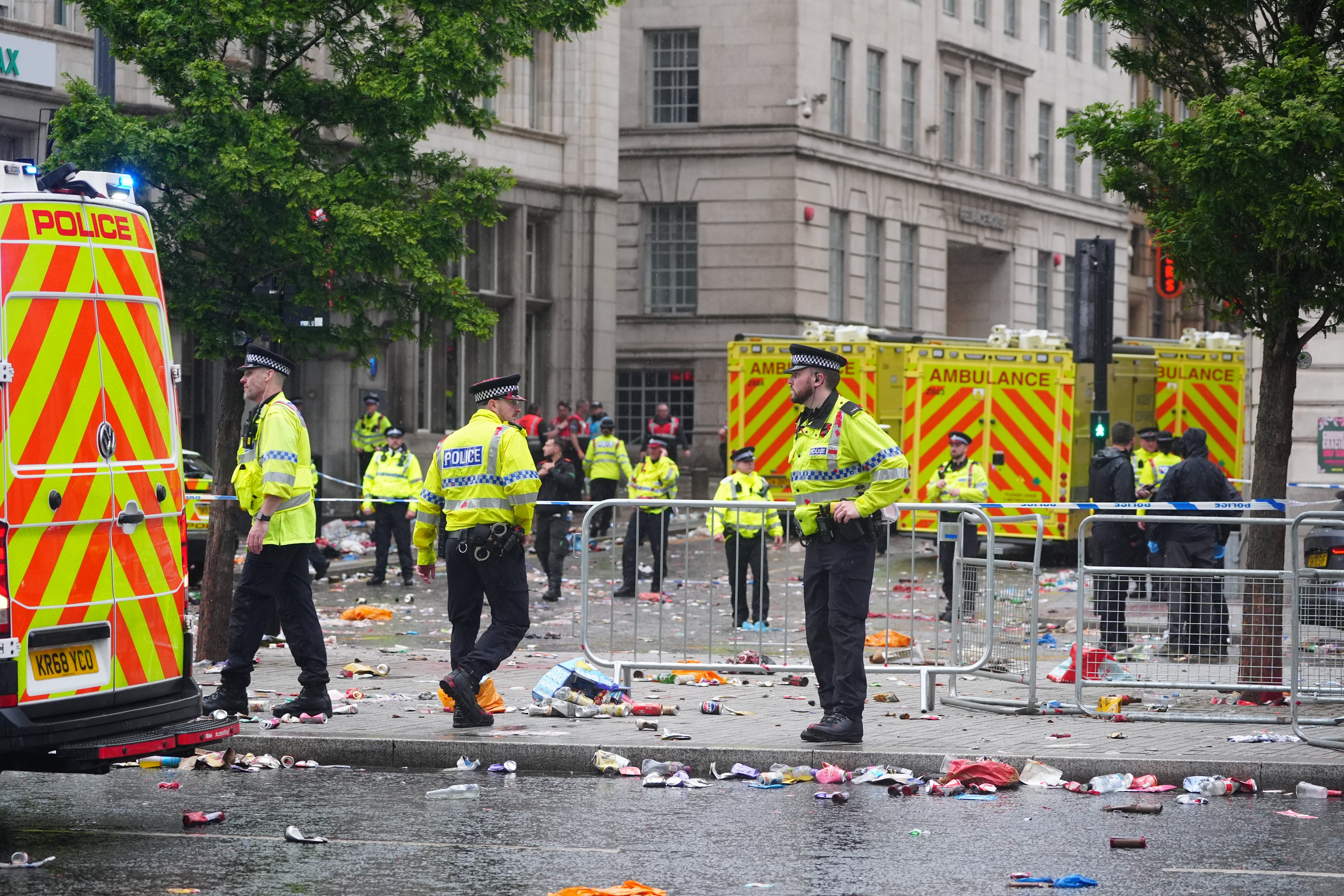 Police and emergency personnel at the cordon (Owen Humphreys/PA)
