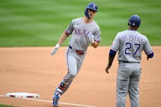 Carter y Burger impulsan a los Rangers a una victoria 4-2 sobre los Nacionales