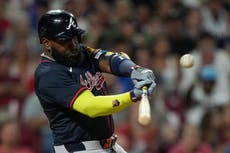 Elevado de sacrificio de Ozuna en la 10ma da a Bravos victoria 12-11 sobre Rojos