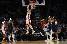Jokic se lesiona al final del primer tiempo, el Heat supera a Nuggets desde entonces y gana 147-123