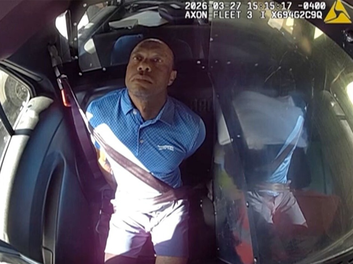 Cámara corporal muestra a Tiger Woods asombrado mientras es esposado tras choque