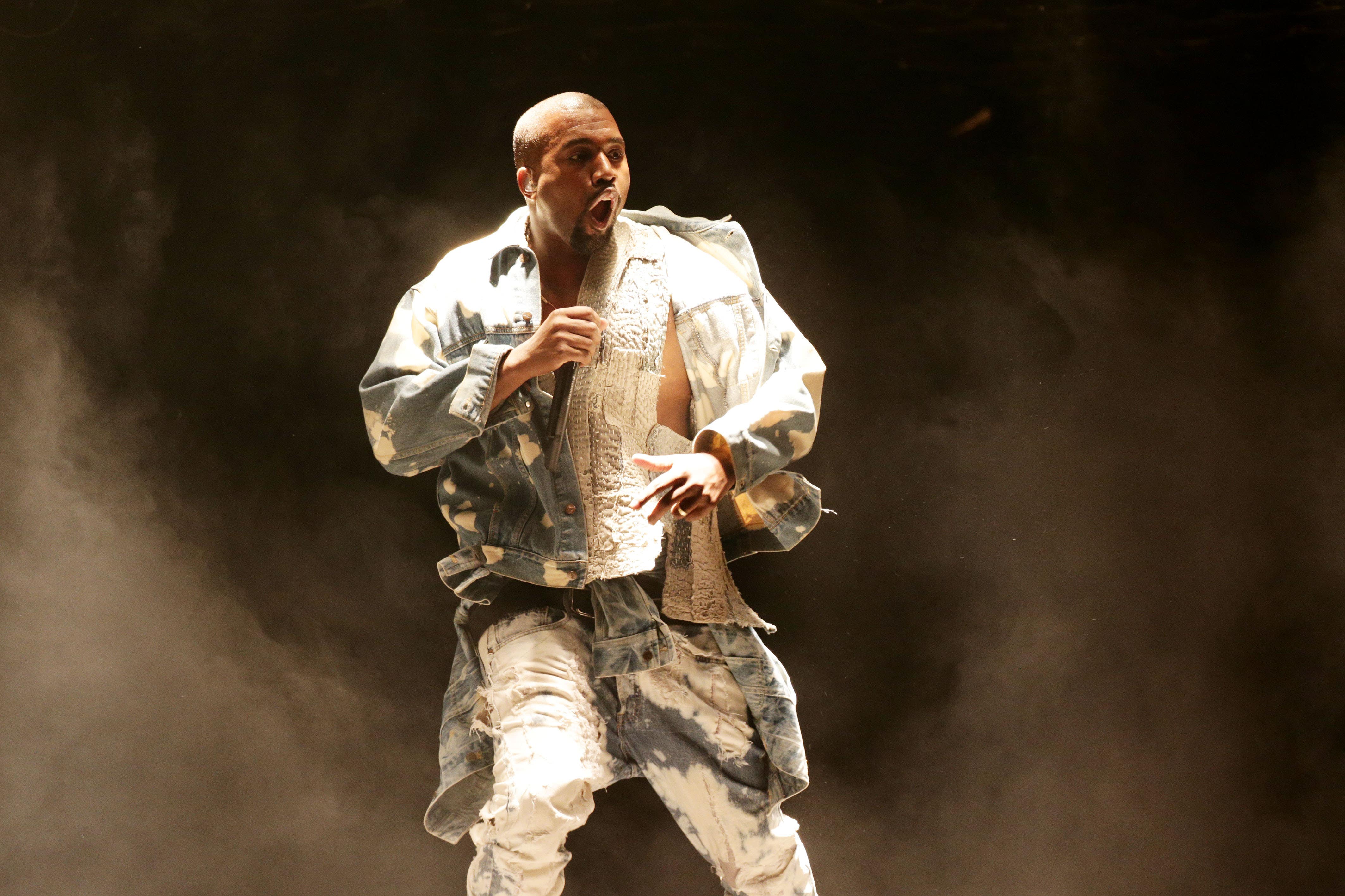 Kanye West performing onstage at Glastonbury in 2015 (Yui Mok/PA)
