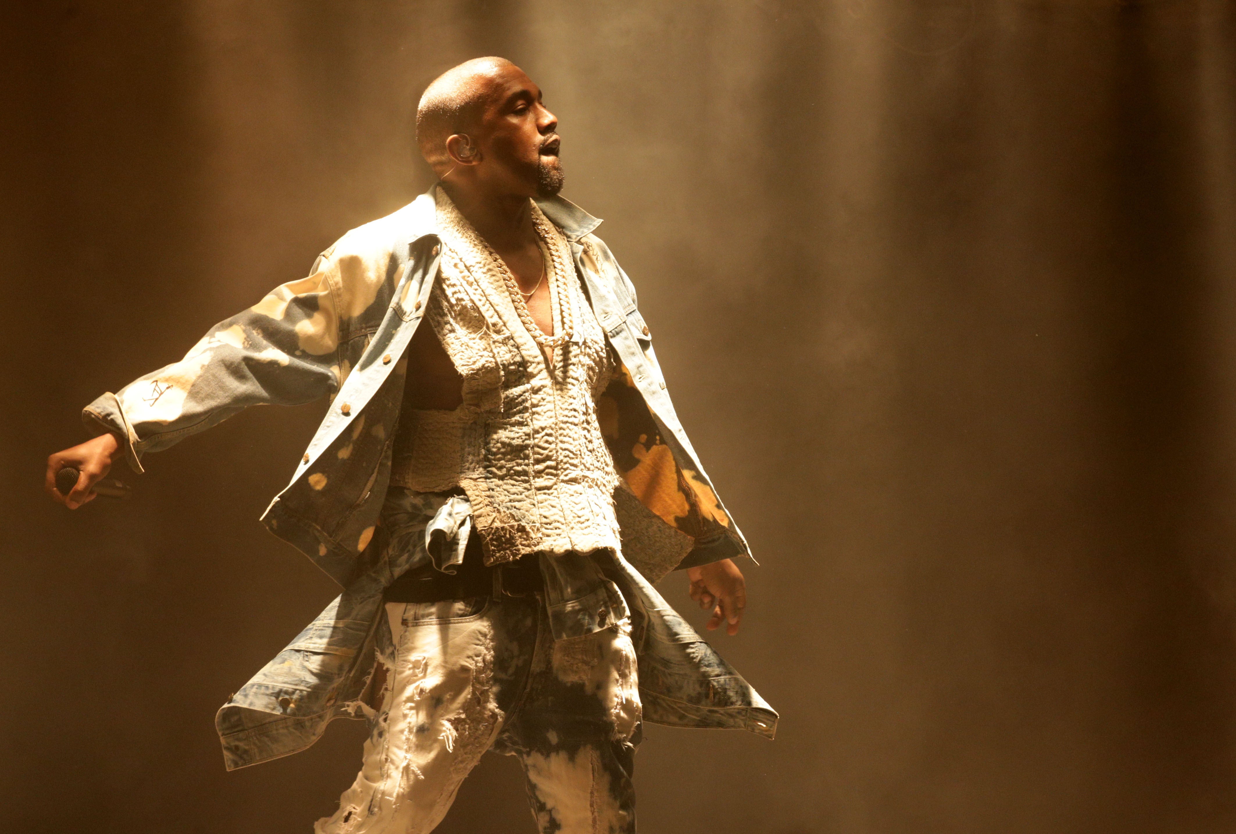 Kanye West performing at the Glastonbury Festival in 2015 (PA)