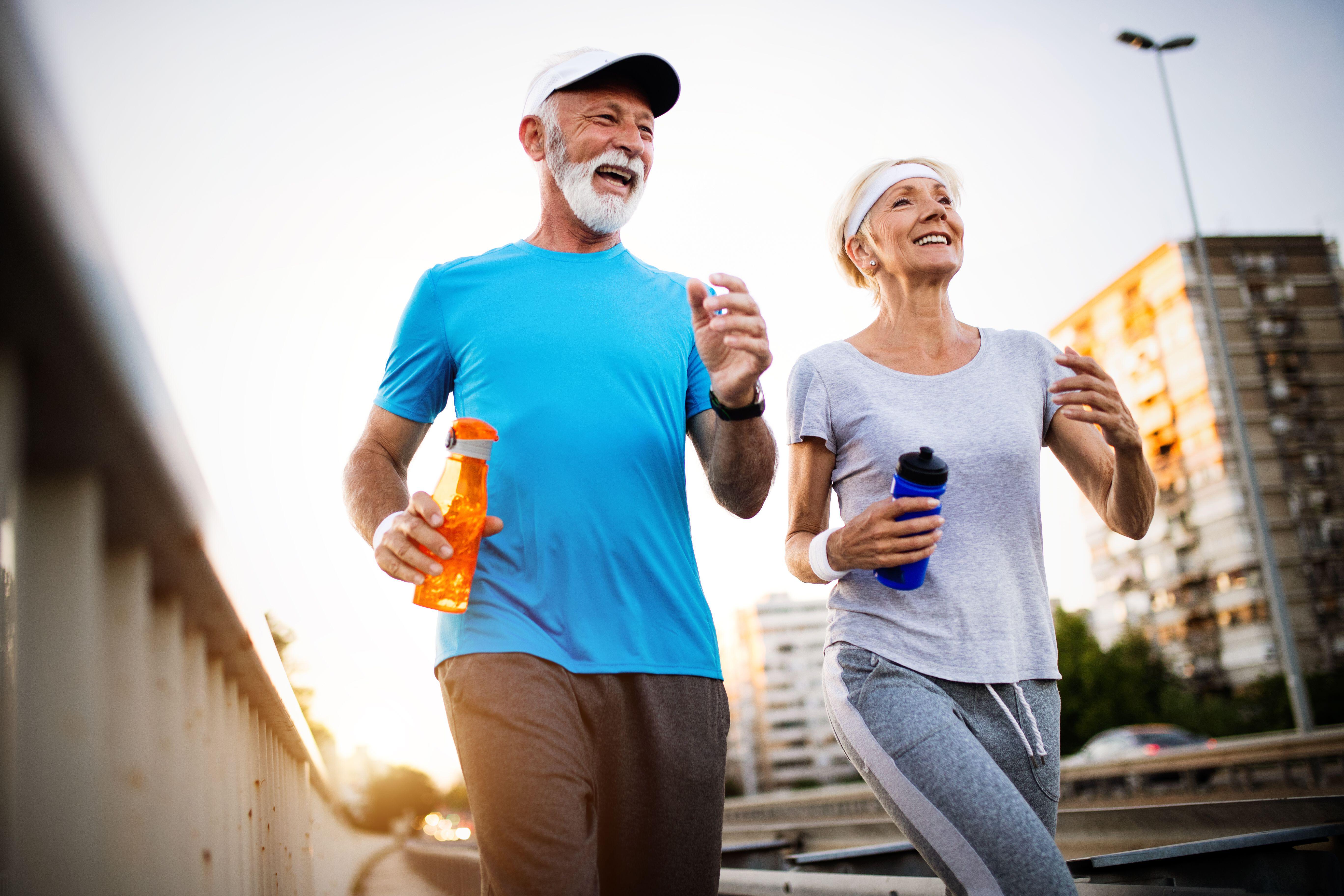 Senior couple running together (Alamy/PA)