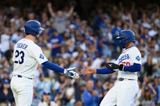 Un error de tiro en la 9na entrada impulsa a los Dodgers 6-5 sobre Orioles