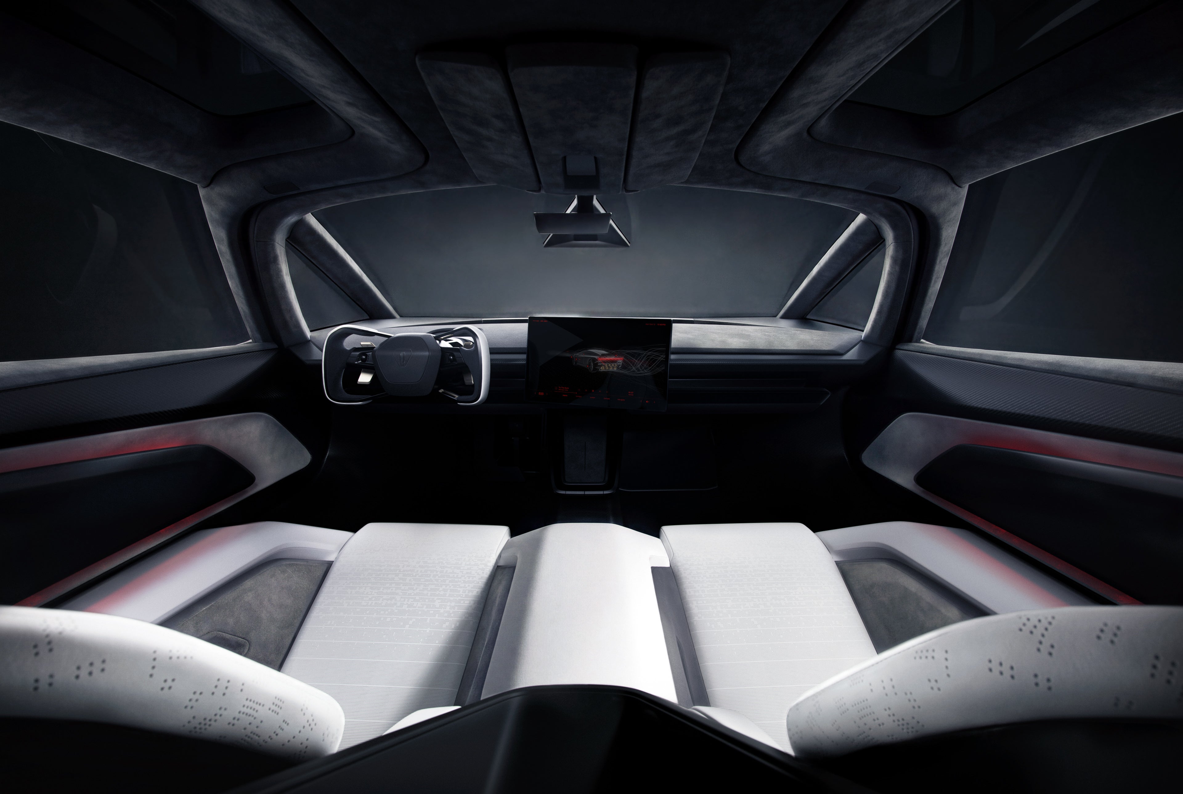 El interior del Tesla Roadster cuenta con un volante tipo yugo y un sistema electrónico de dirección ‘steer-by-wire’