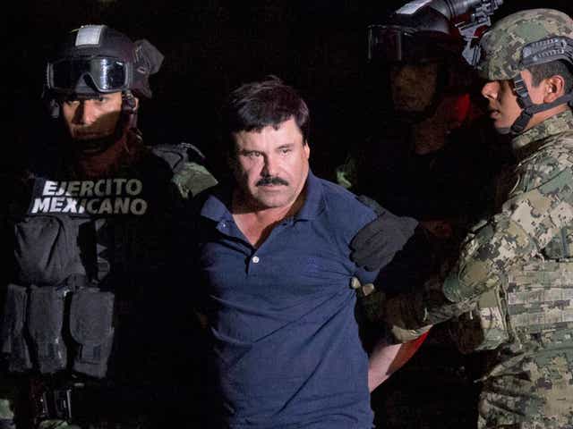 <p>Joaquin "El Chapo" Guzman is escorted by soldiers to a helicopter in Mexico City, after he was recaptured from breaking out of a maximum security prison in January</p>