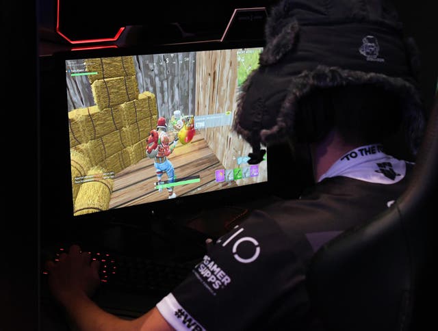 <p>A gamer plays "Fortnite" against Twitch streamer and professional gamer Tyler "Ninja" Blevins during Ninja Vegas '18 at Esports Arena Las Vegas at Luxor Hotel and Casino on April 21, 2018 in Las Vegas, Nevada</p>