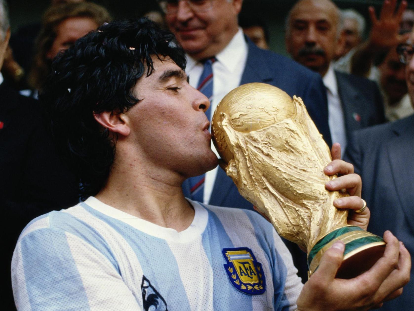 Diego Maradona kisses the World Cup trophy in 1986